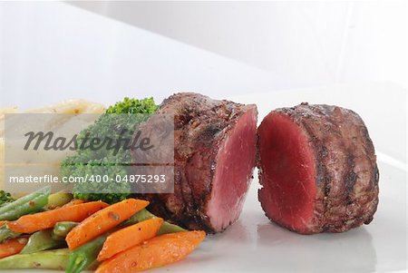fresh and tasty beef grilled steak with vegetable in a plate.