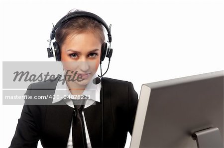 pretty girl with a headset works at the computer