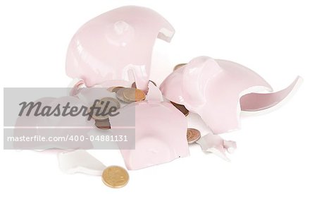 Broken piggy savings bank against a white background