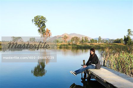 girl on pier at lake