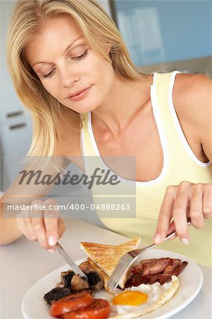 Mid Adult Woman Eating Unhealthy Breakfast