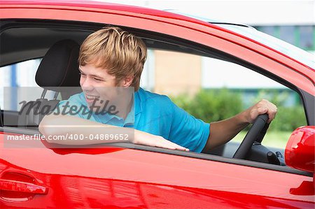Teenage Boy Sitting In Car