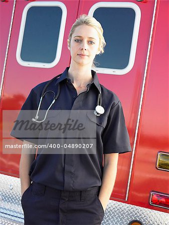 Portrait of paramedic in front of ambulance