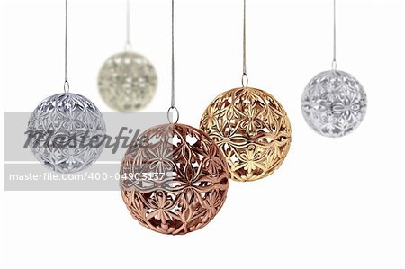 Gold copper silver Christmas balls hanging on white background