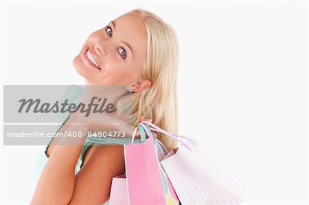 Portrait of a Joyful smiling woman with shopping bags in a studio