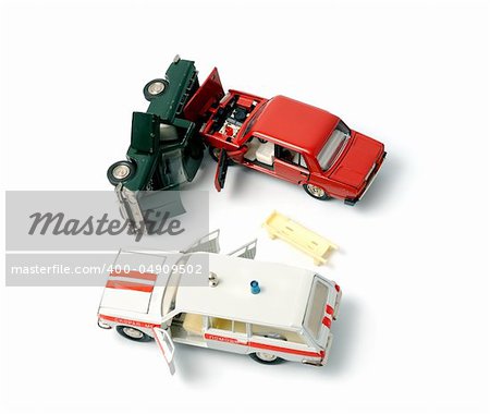 Toy cars in accident on a white background