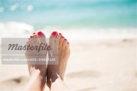 Girls feet in the sand