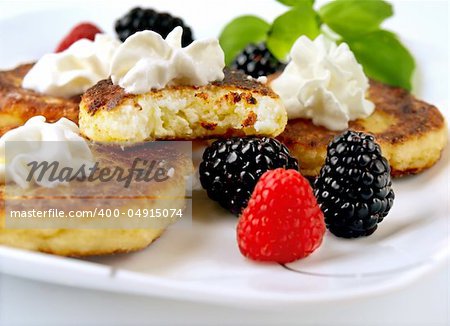 Cottage cheese pancakes garnished with fresh berries