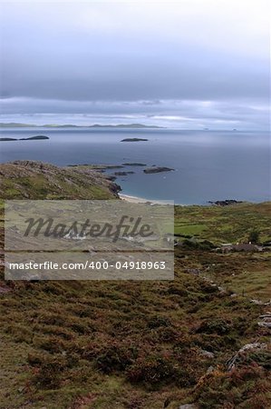 scenic view in kerry ireland of fields coastline and islands