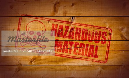 Hazardous Material stamp on wooden background.