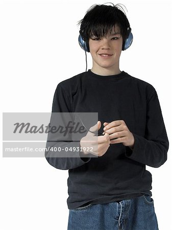 isolated teen listing to music holding mp3