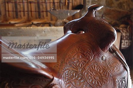 Leather saddle in old barn