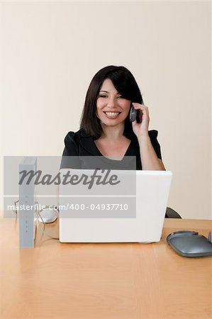 Emerging technologies - a woman using voip technology to make an internet phone call.