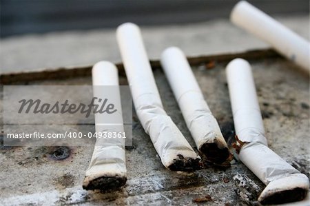 Smoked Cigarettes on a Window Sill - Stop Smoking Campaign