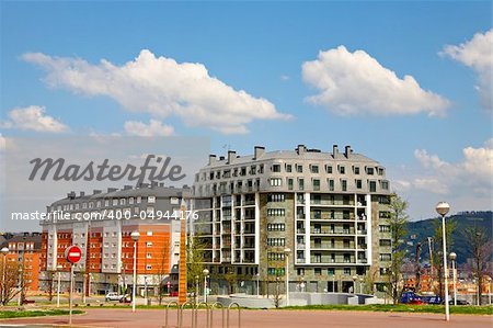 A built modern apartments blocks over a sunny sky