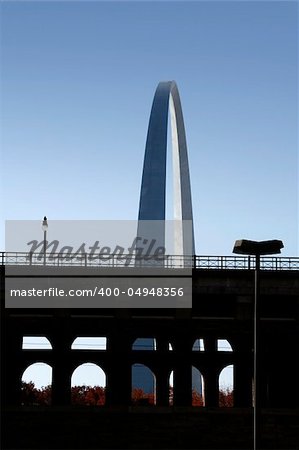 The Arch at St. Louis behind a bridge