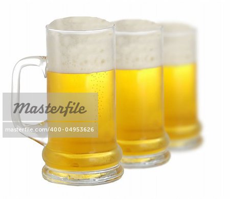 Three pints of beer isolated on white background
