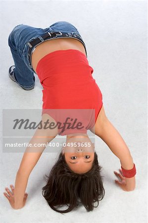 Break dancing girl in bridge pose (high view)