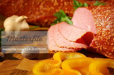 Gentle ham with yellow pepper and garlic  Tasty meat natural composition in country style.
