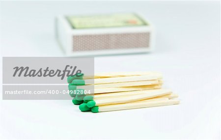 Green wooden matches over the box