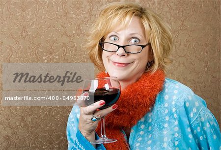 Woman with a big grin drinking red wine
