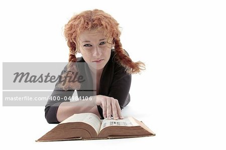 Sad looking young redhead with book, isolated