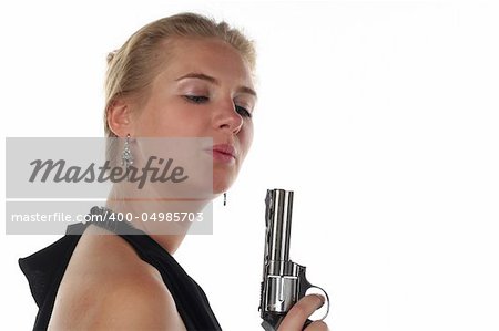 young blond woman in black dress with revolver isolated on white background