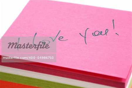 Words about love written on a pink paper