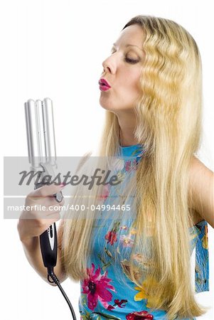 Long hair blonde woman with professional multi-styling set in her hand
