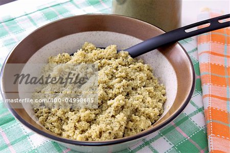 A bowl of flavored spiced cous cous as dinner carbohydrate