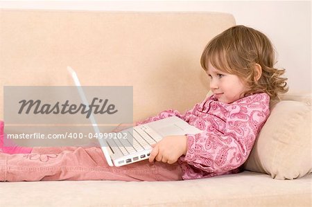 young girl using a laptop. computer generation