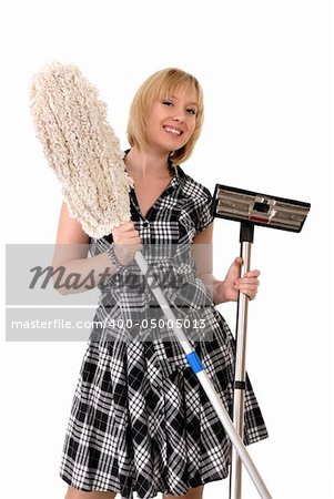 happy blond housewife with broom & vacuum cleaner