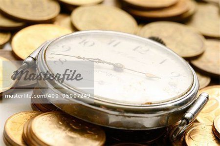 time is money coins and clock macro concet