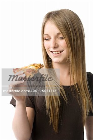 Beautiful young blond woman about to eat a slice of pizza.