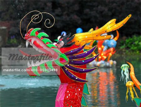 Portrait of an Illuminated Chinese Dragon on a lake