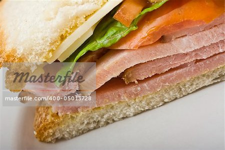 close up of a  ham and cheese sandwich