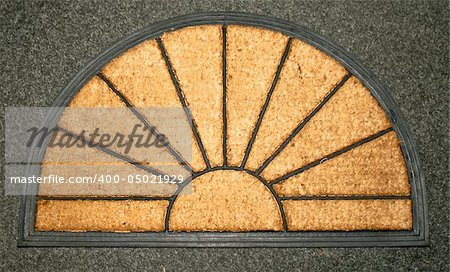 Doormat made from natural material in sun shape