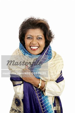 A beautiful Indian woman smiling in traditional clothing.  Isolated on white.