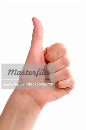 An adult female hand holding their thumb in the air. Seen from the side with the thumb bending backwards. Includes clipping path.