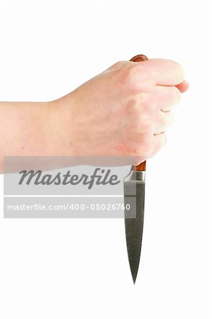 A small pearing knife in the hand of a woman.  The knife is held in a dagger grip. Isolated on white with clipping path.