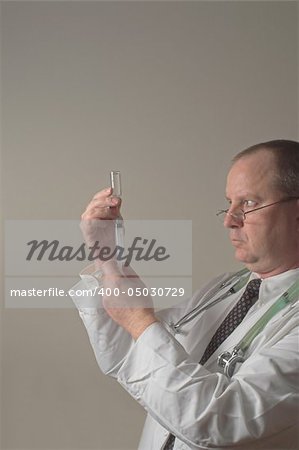 A medical doctor preparing an injection in a syringe.