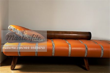 Leather stylish sofa on a background of a wall