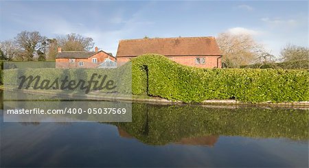 Houses next to canal or river.