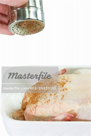 Raw Chicken in a bowl on bright Background