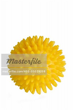 Yellow massage ball isolated on white.