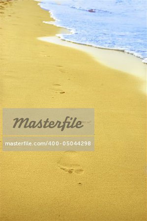 Beachwalk - footprint on a sandy beach.