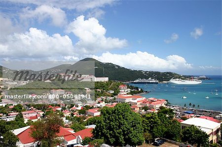 Cruise ships are docked at the port in St Thomas in the Caribbean on a beautiful sunny day.
