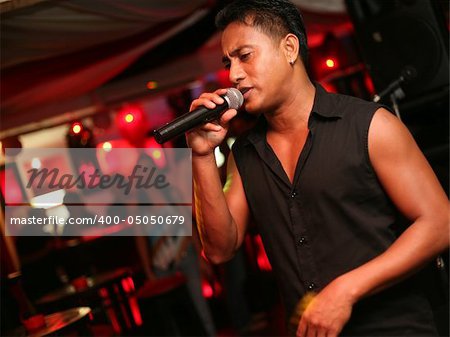 Singer at an alive concert in a night club "La vida loka". Bali. Indonesia