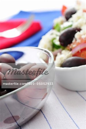 Black kalamata olives and greek salad with feta cheese