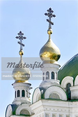 Orthodox crosses on blue sky background